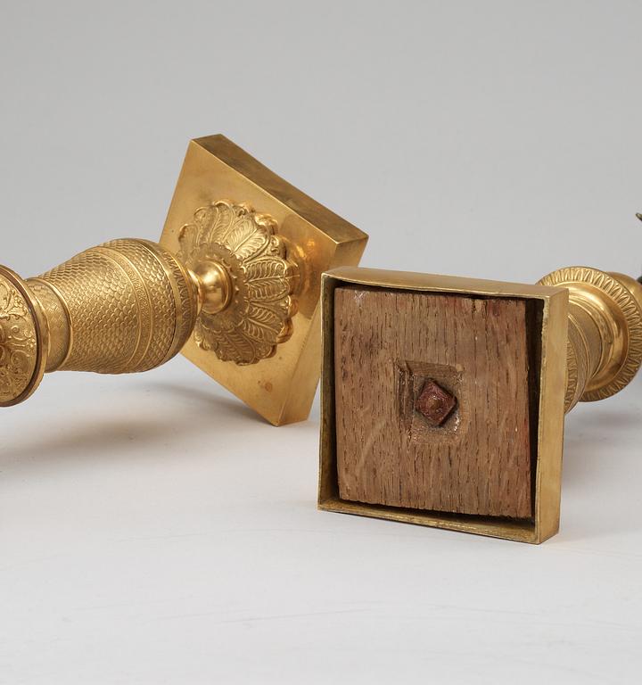 A pair of French Empire early 19th century three-light candelabra.