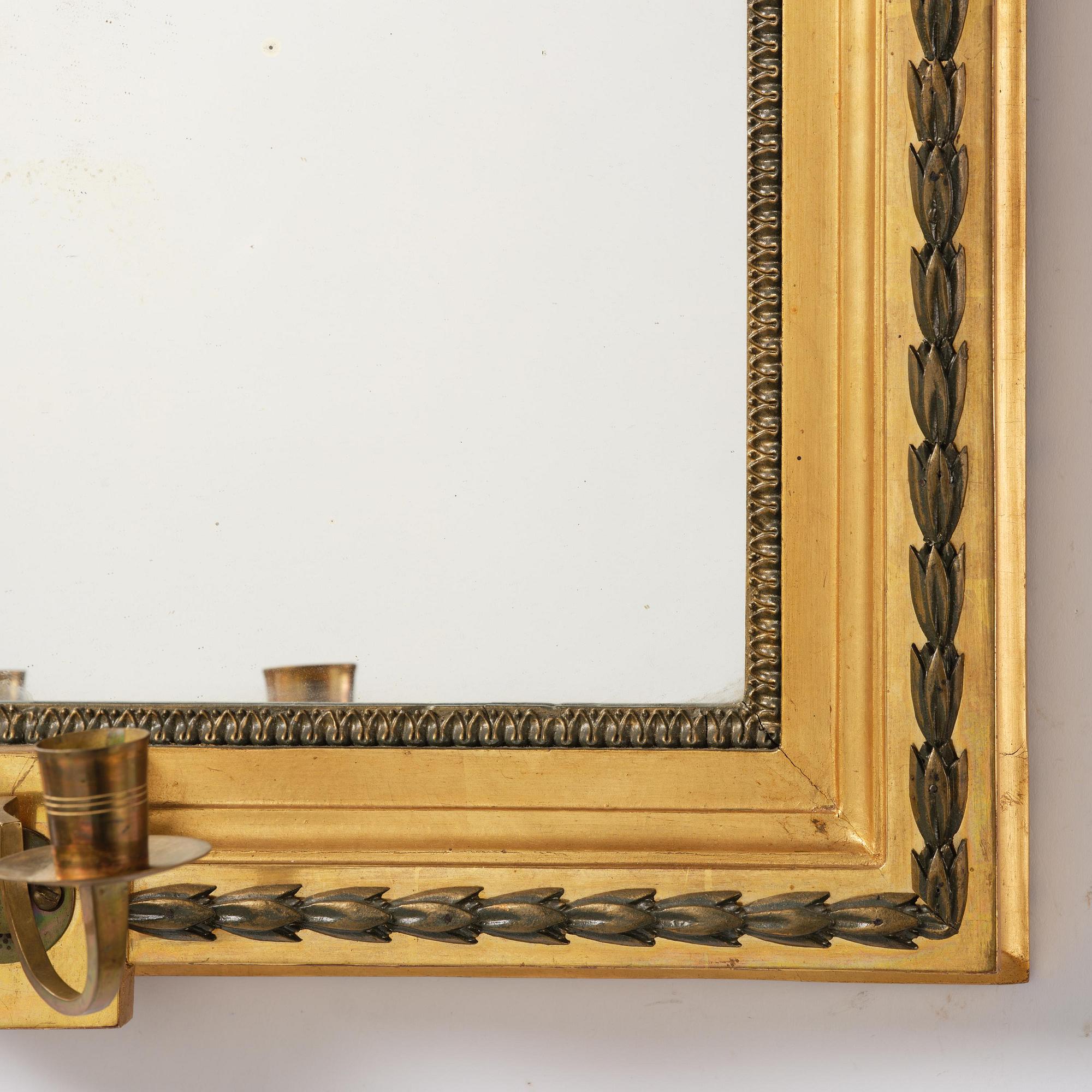 A pair of two-branch giltwood girandole mirrors attributed to P. Ljung (1743-1819).
