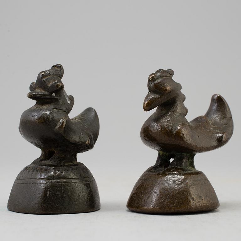 Two opium weights, Burma, circa 1900.