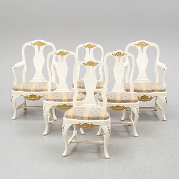 A dining table and six chairs, rococo style, mid 20th century.