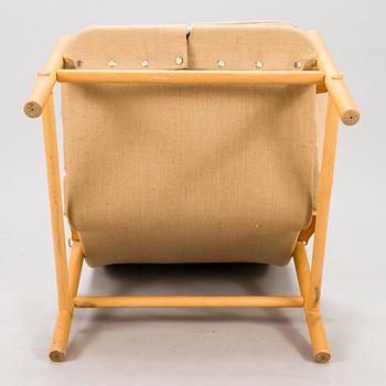 BROR BOIJE, A pair of 'Junker' easy chairs and an ottoman for Dux, Sweden, latter half of the 20th Century.