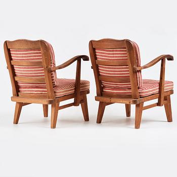 Nordiska Kompaniet, a pair of "sportstugemöbler" stained pine easy chairs, Sweden 1930-40's.