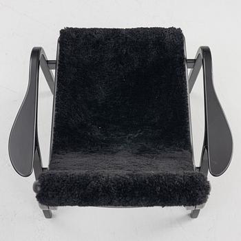 Yngve Ekström, a 'Lamino' easy chair with footstool, Swedese, 2018.