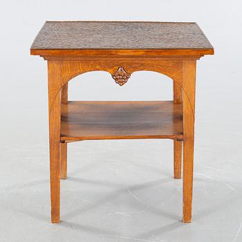 CARL CHRISTIAN CHRISTENSEN, a jugend smoking table, signed and dated 1910.