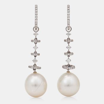 1182. A pair of cultured South sea pearl earrings with brilliant-cut diamonds.