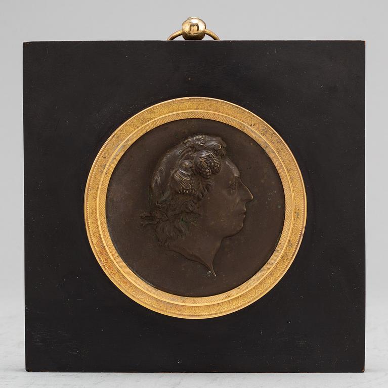 A Swedish Empire copper and gilt bronze portrait medallion representing Carl Michael Bellman.