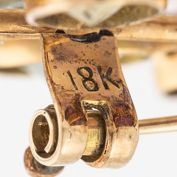 Brooch, 18K gold with citrine, amethyst, and tourmaline among others.