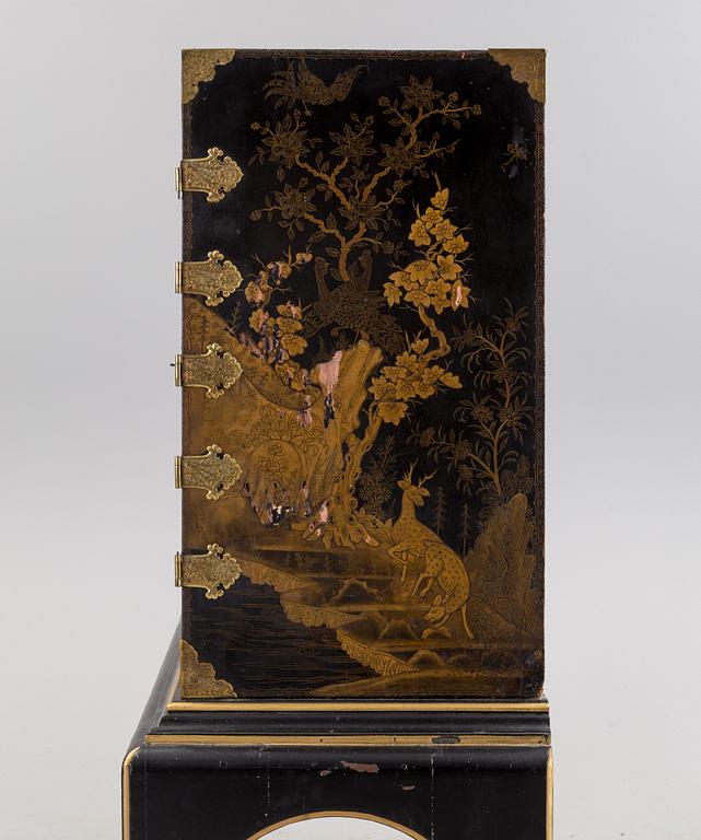 AN early 18TH CENTURY PROBABLY ENGLISH Japanned laquer cabinet on stand.