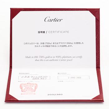 Cartier, an 18K gold 'Trinity Pendant' necklace with a brilliant-cut diamond.