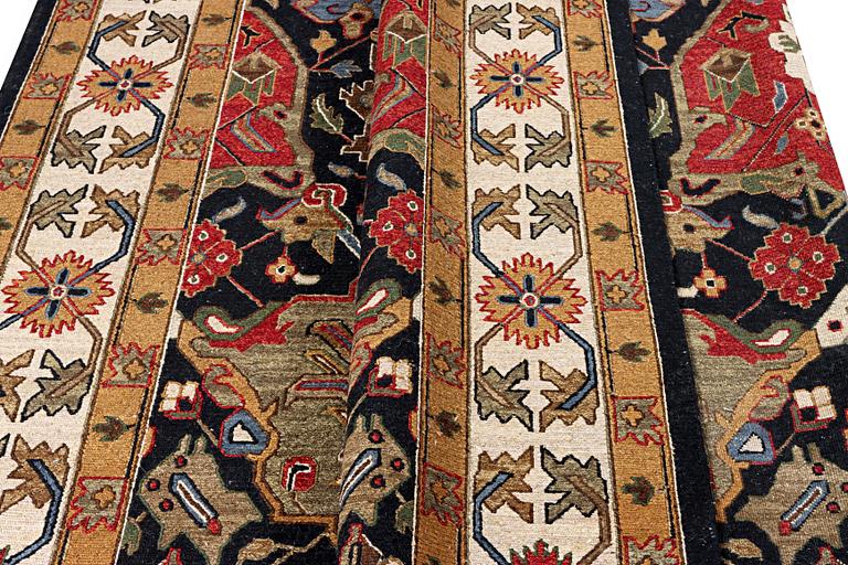 An oriental carpet with Mamluk design, c. 364 x 276 cm.