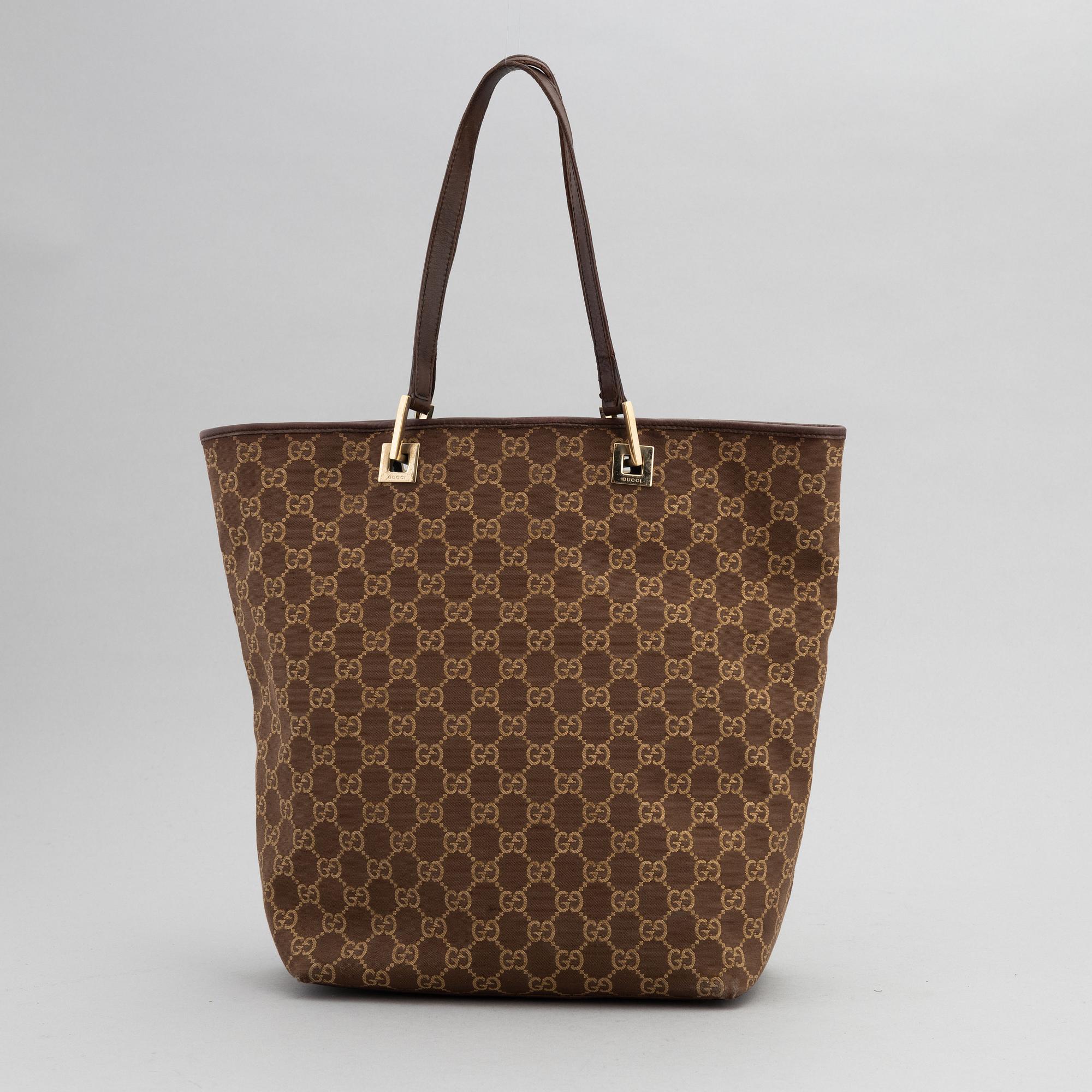 Gucci, a monogram canvas handbag.