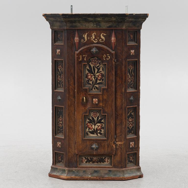 A Swedish painted corner cupboard, 18th Century.