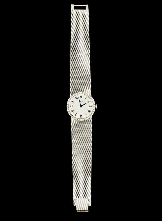 DAMARMBANDSUR, 18k vitguld med åttkantslipade diamanter, Piaget. Vikt ca 46 g.