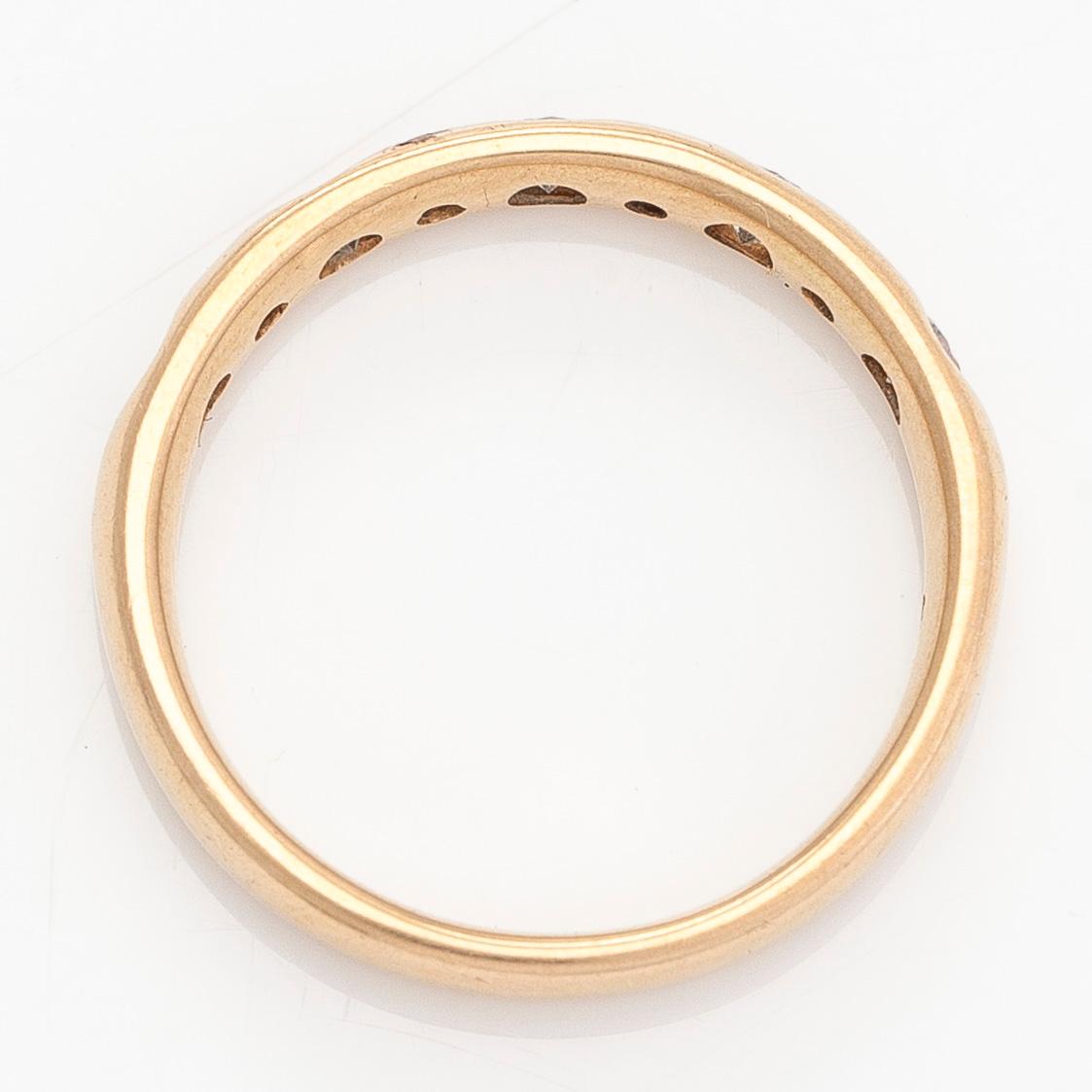 A 14K gold half eternity ring, set with brilliant-cut diamonds, total approximately 0.26 ct. Finnish import marks  1997.