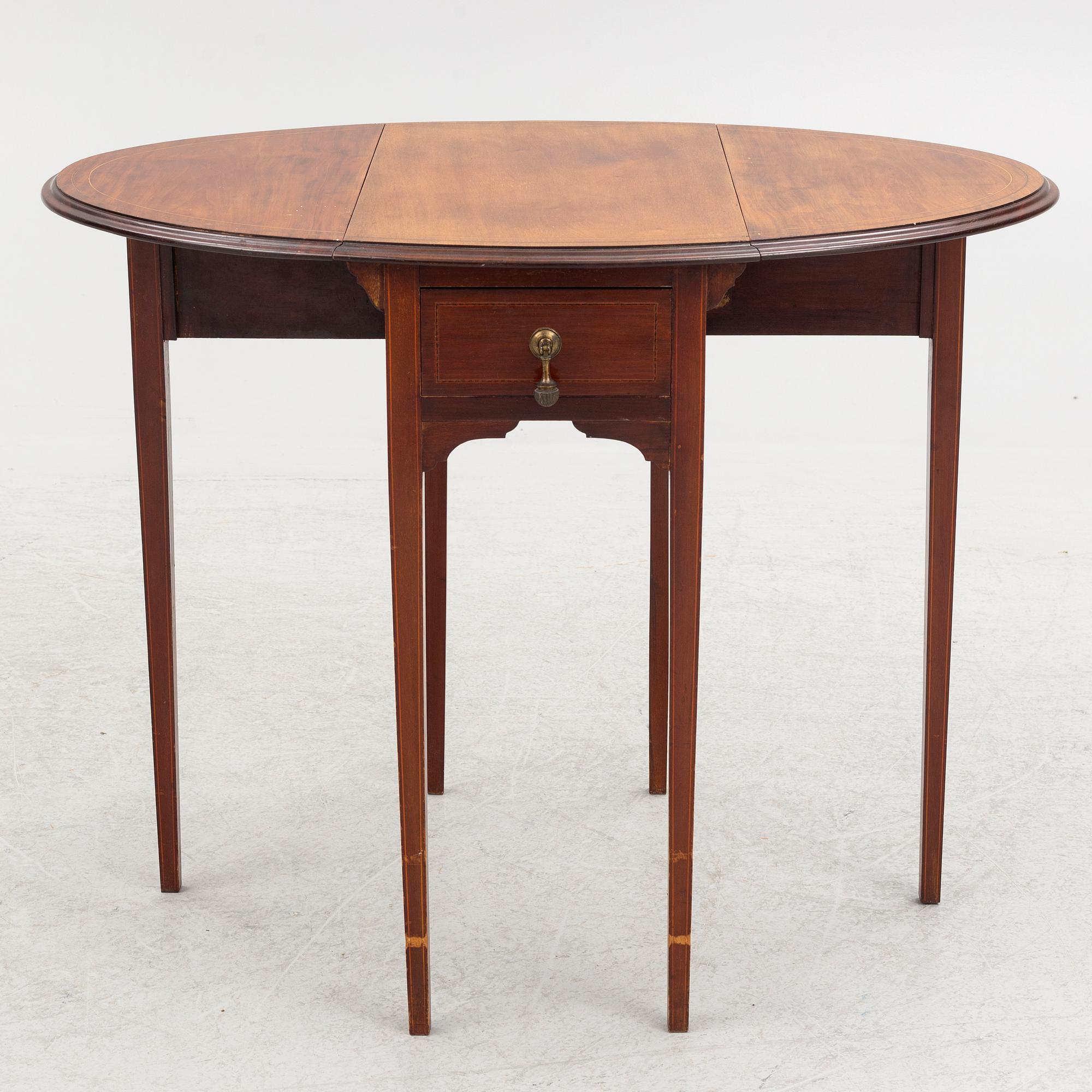 A drop-leaf table, England, early 20th Century.