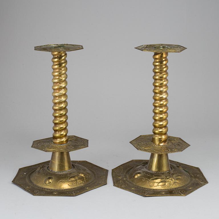 A pair of baroque style candle holders.