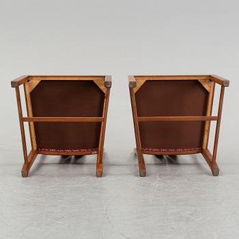 An 'Ambassadör' dining table with eight chairs by Carl Malmsten, second half of the 20th Century.