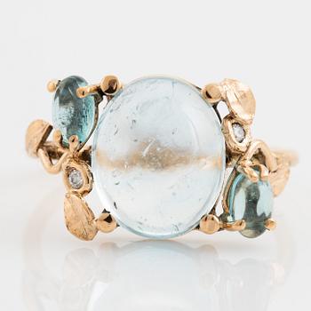 Cabochon cut topaz, apatite and brilliant cut diamomnd ring.
