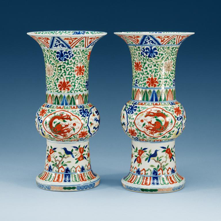 A pair of wucai vases, presumably 20th Century with Wanli six character mark.