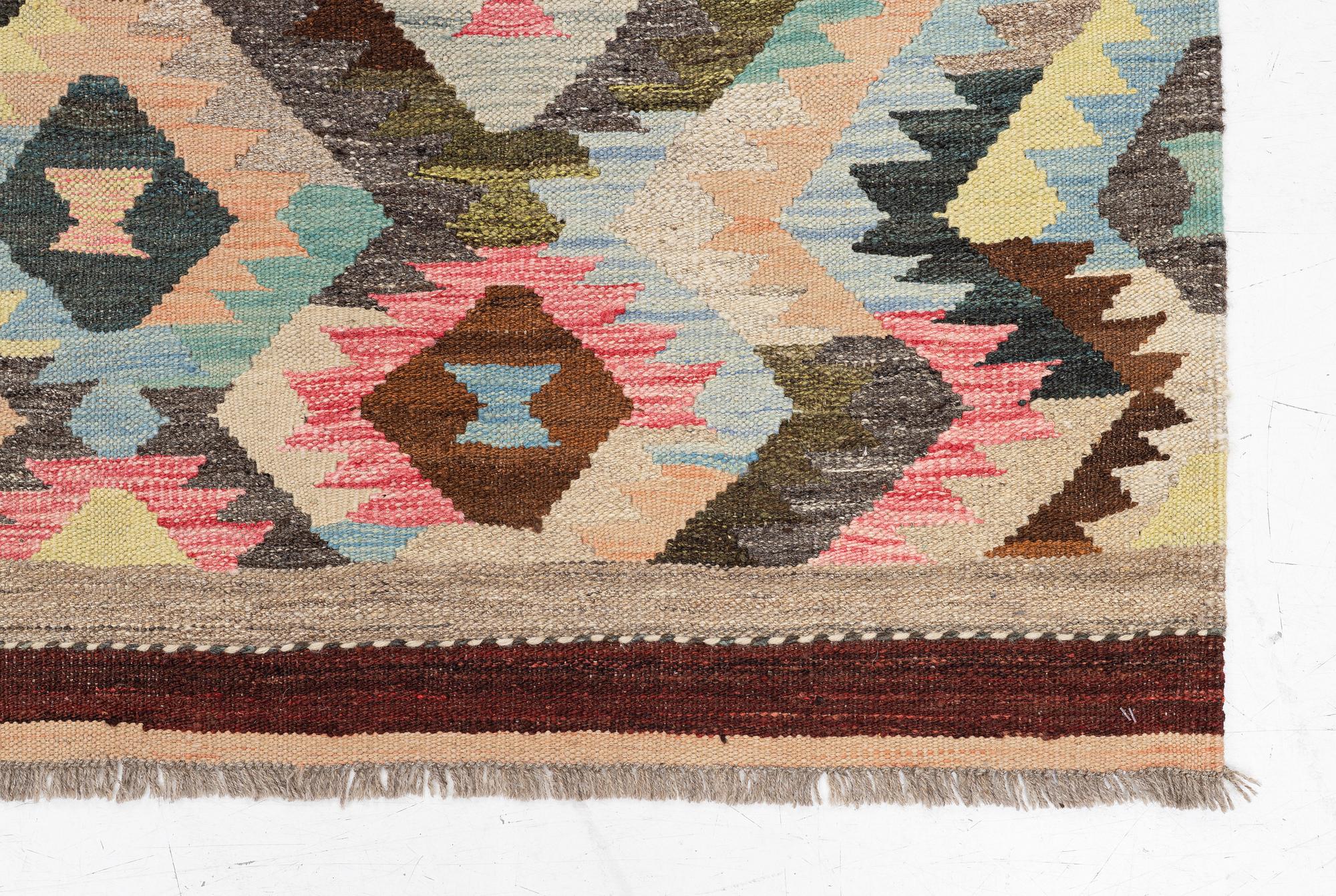 A Kelim carpet, c. 240 x 178 cm.