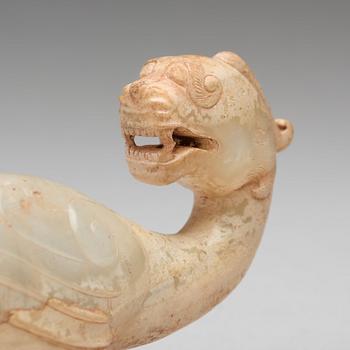 A Chinese archastic sculptured cane handle.