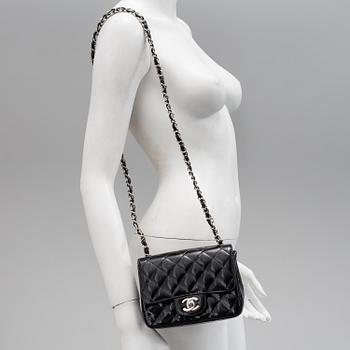 A black lacquer "Classic mini" bag by Chanel 2009-2010.