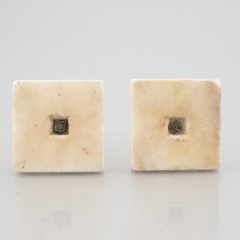 A pair of marble and gilt-bronze Louis XVI-style candelsticks, circa 1900.