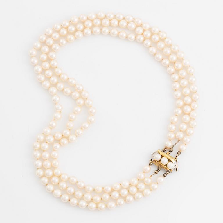 Three-row pearl necklace, cultured pearls, gold clasp with octagonal cut diamonds.