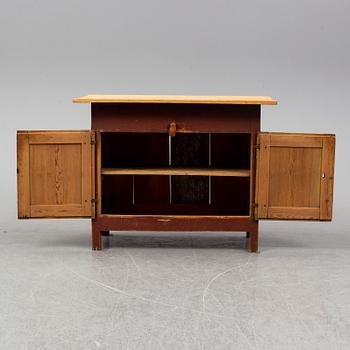 A painted table with cabinet, dated 1857.