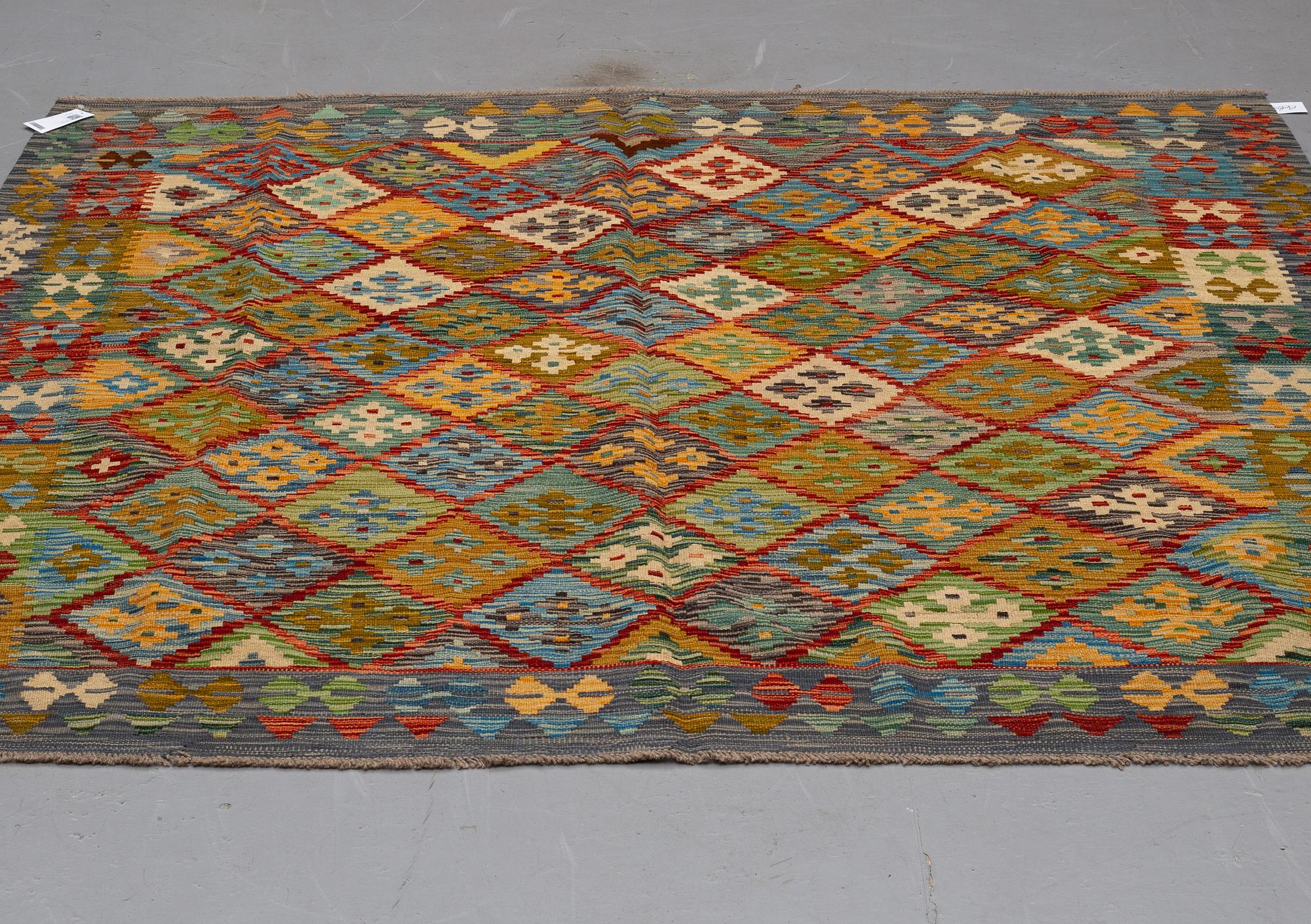 A kilim rug, ca 199 x 201 cm.