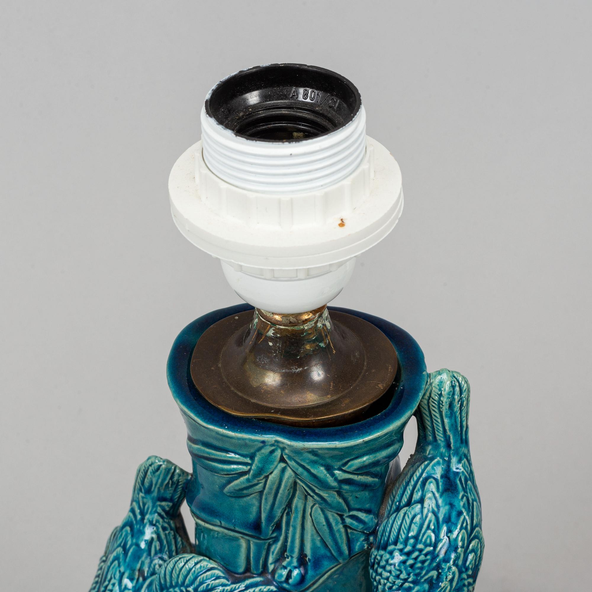 A pair of Chinese blue glazed porcelain table lamps/vases, early 20th century.