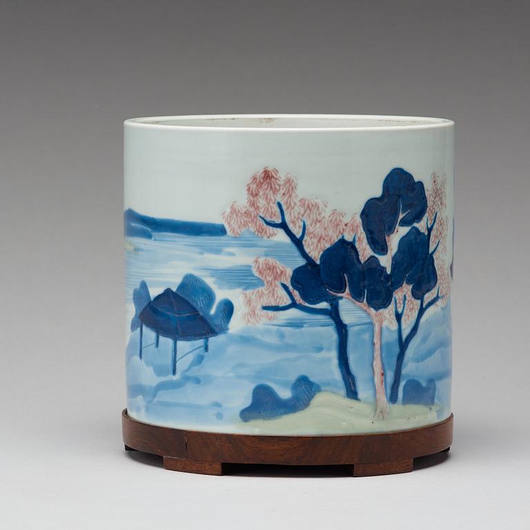 An underglaze blue, copper-red and celadon-glazed brushpot, Qing dynasty, early 18th Century, with Chenghuas mark.