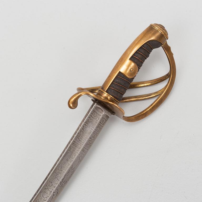 An 19th Century curved officer's sword with etched blade and steel scabbard.