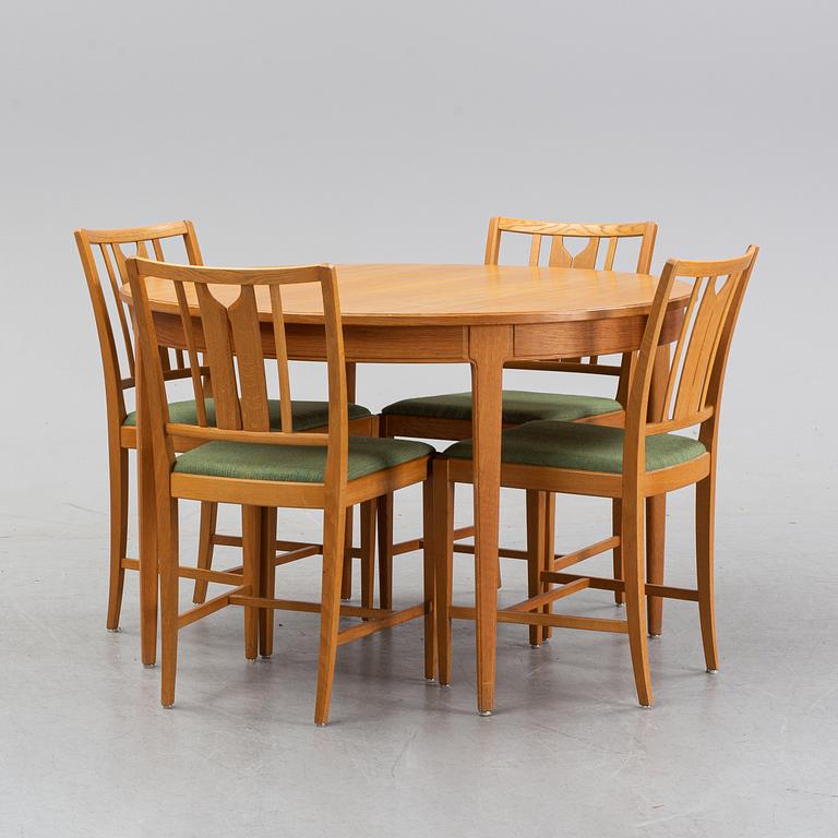 An oak dining table and four chairs by Carl Malmsten for Bodafors. Second half of the 20th Century.