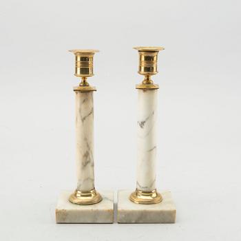 A pair of Late Gustavian marble candle sticks.