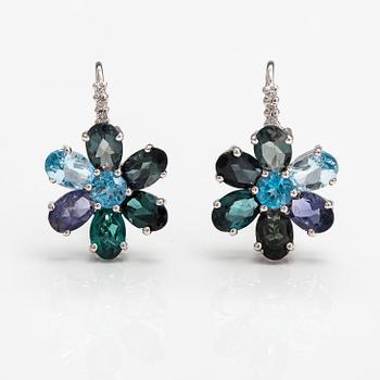 A pair of 14K white gold earrings with tpoazes, cordierites and tourmalines.