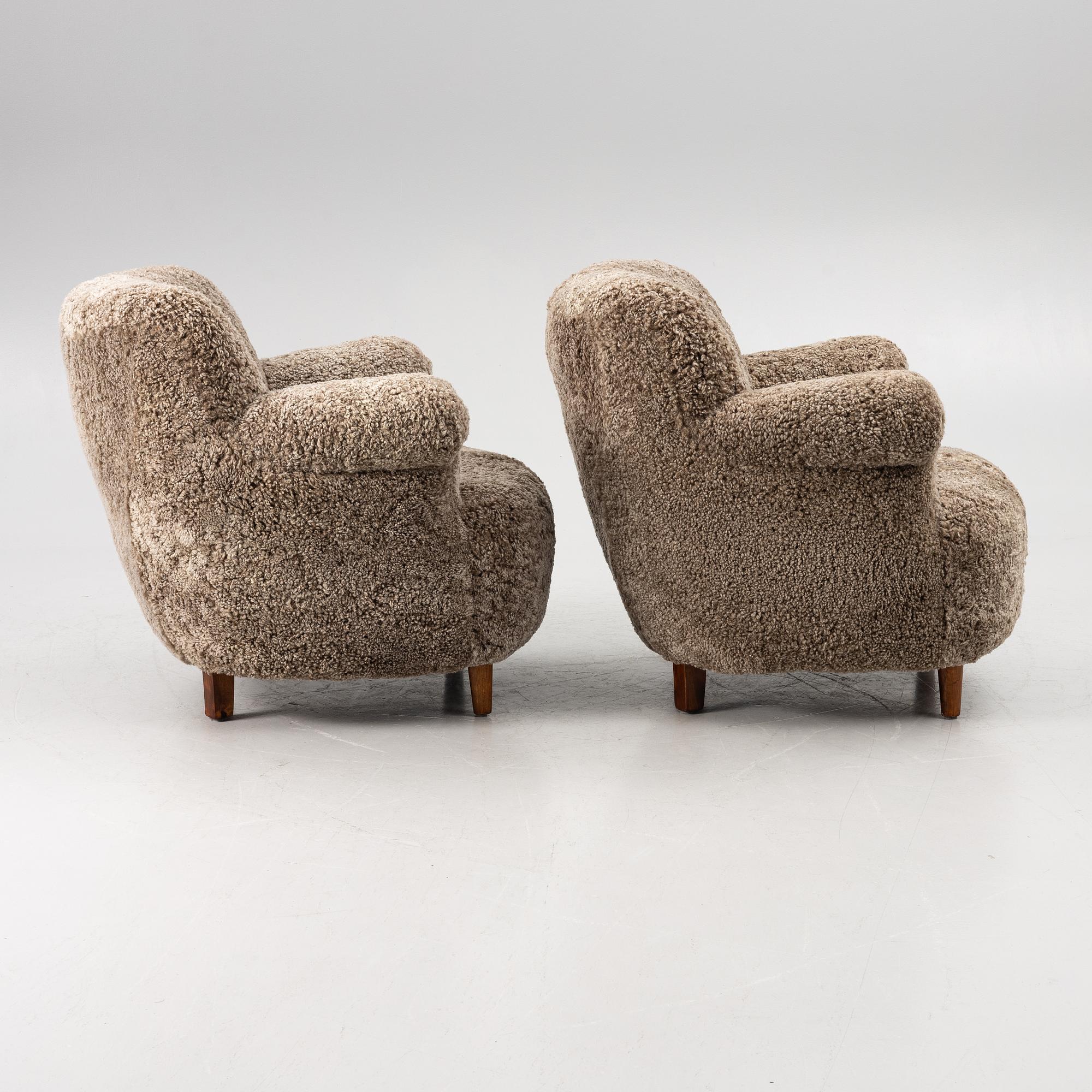 A pair of easy chairs, mid-20th century.