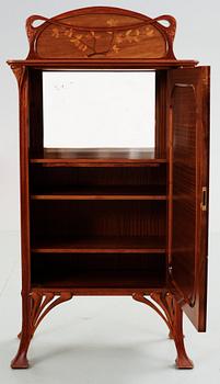 387. An Art Nouveau mahogany cabinet with inlays and carved decoration, possibly France or Belgium, circa 1900.