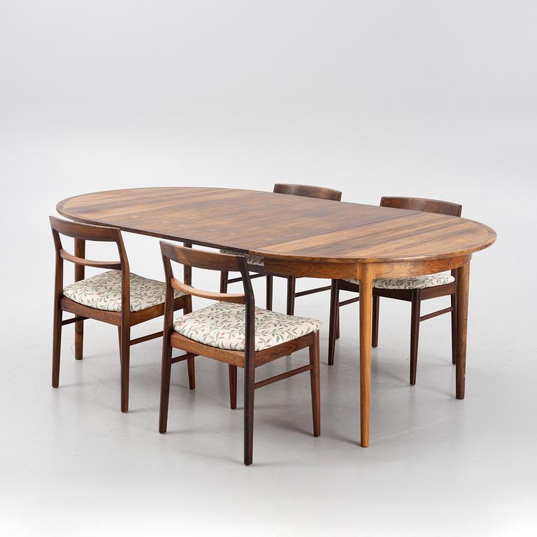 A Rosewood dining table and four chairs, Denmark. 1960-tal.