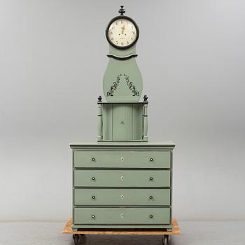 A combined clock and chest of drawers from late 19th  century.