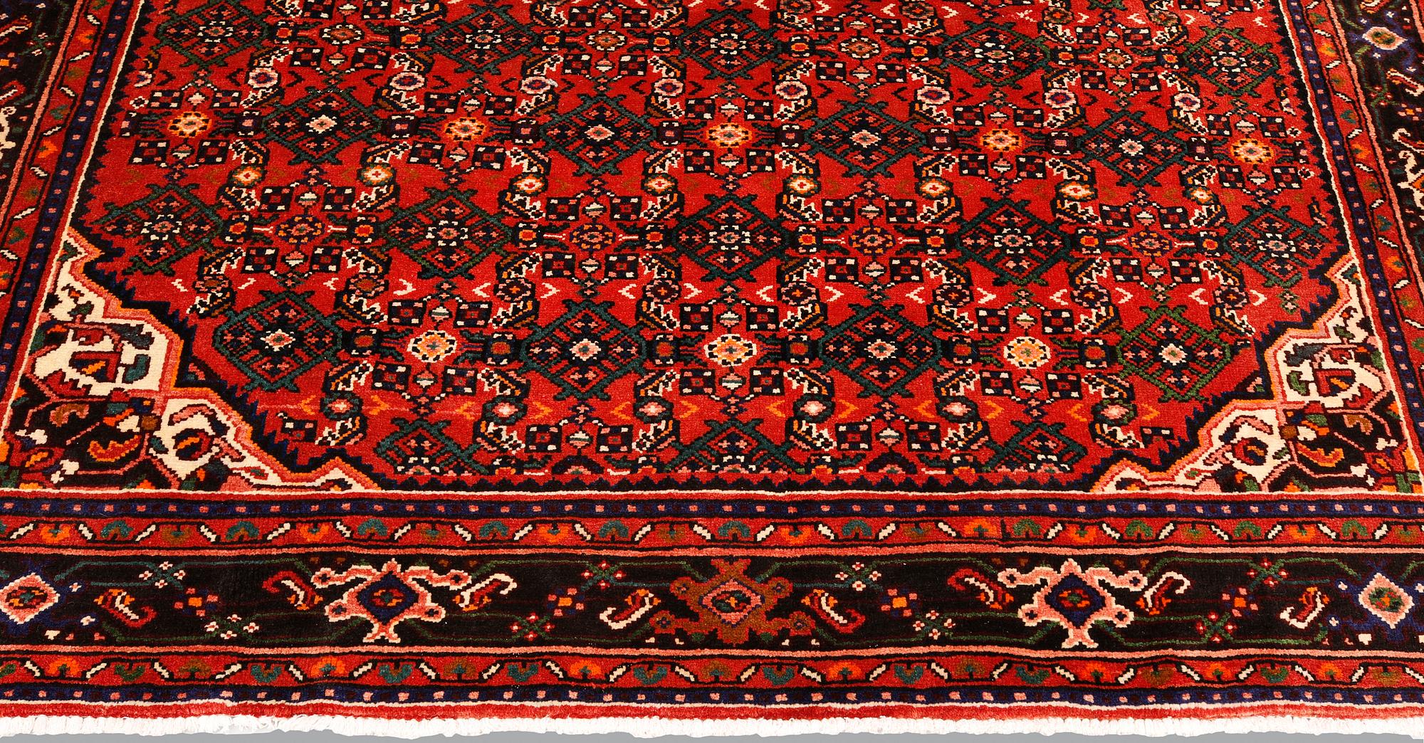A Hosseinabad carpet,, ca 310 x 210 cm.