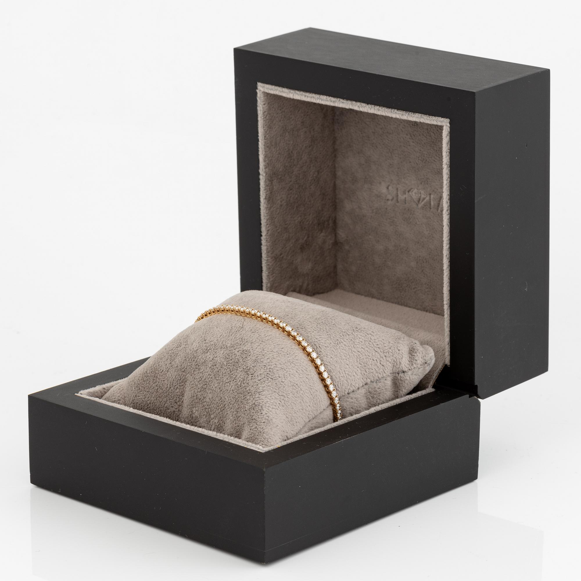 Tennisarmband 18K guld med briljantslipade diamanter.