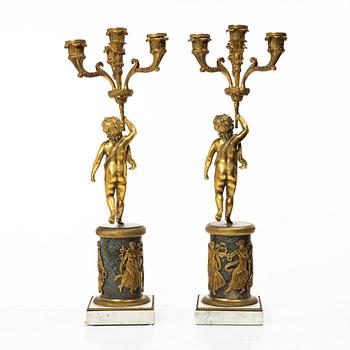 A pair of Empire style candelabra, circa 1900.