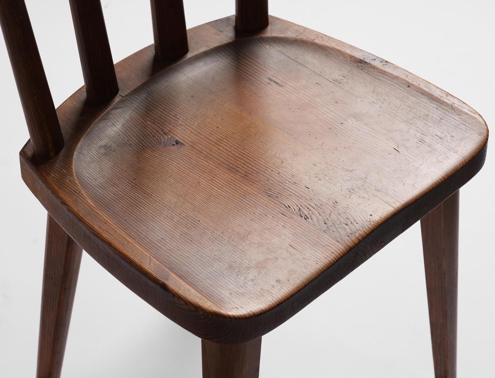 Axel Einar Hjorth, a set of four stained pine "Utö" chairs, Nordiska Kompaniet, Sweden, 1930s.