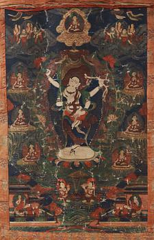 A Beijing Thangka of a four-armed goddess surrounded by Buddhist pantheon, 1920's.