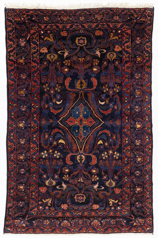 A semi-antique Khoigân village carpet, Feridan area, ca 314 x 209 cm.