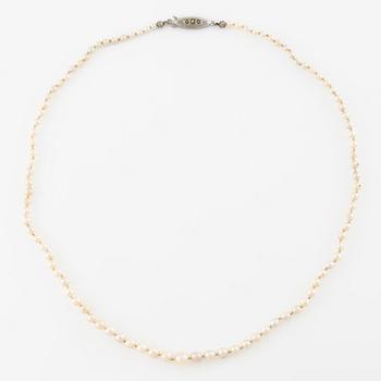 Pearl necklace, graduated pearls, clasp silver with pyrite.