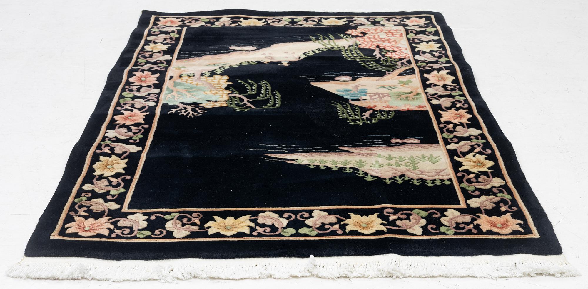 A Chinese rug, c. 183 x 120 cm.