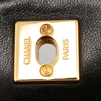 A 'Mini Flap' Chanel lamb skin handbag.