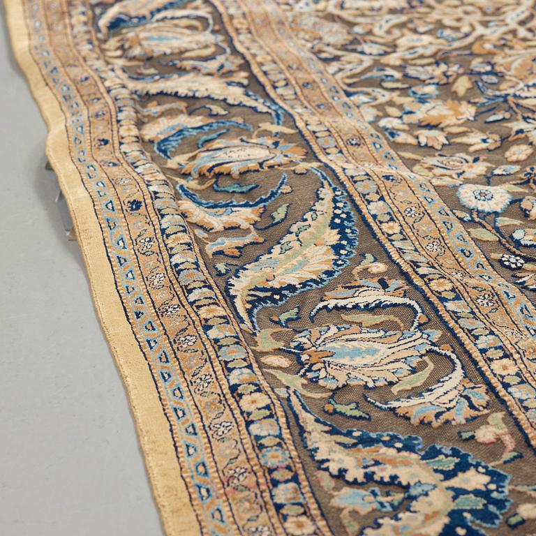 A RUG. A semi-antique silk Kashan Souf (in relief). 210 x 131,5 cm (as well as one cm flat weave at each end).